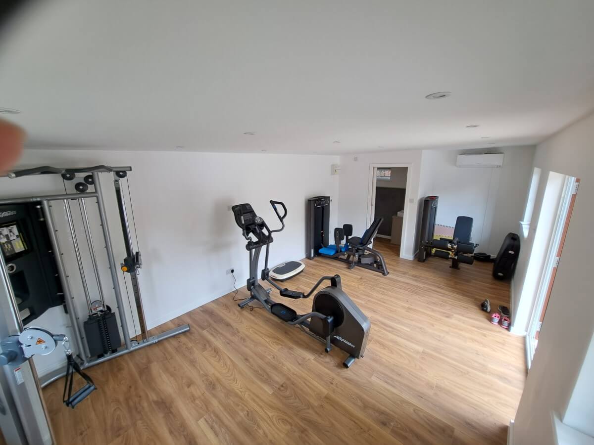 Bespoke garden Gym room with integrated toilet in Kingston, Surrey - internal view 1
