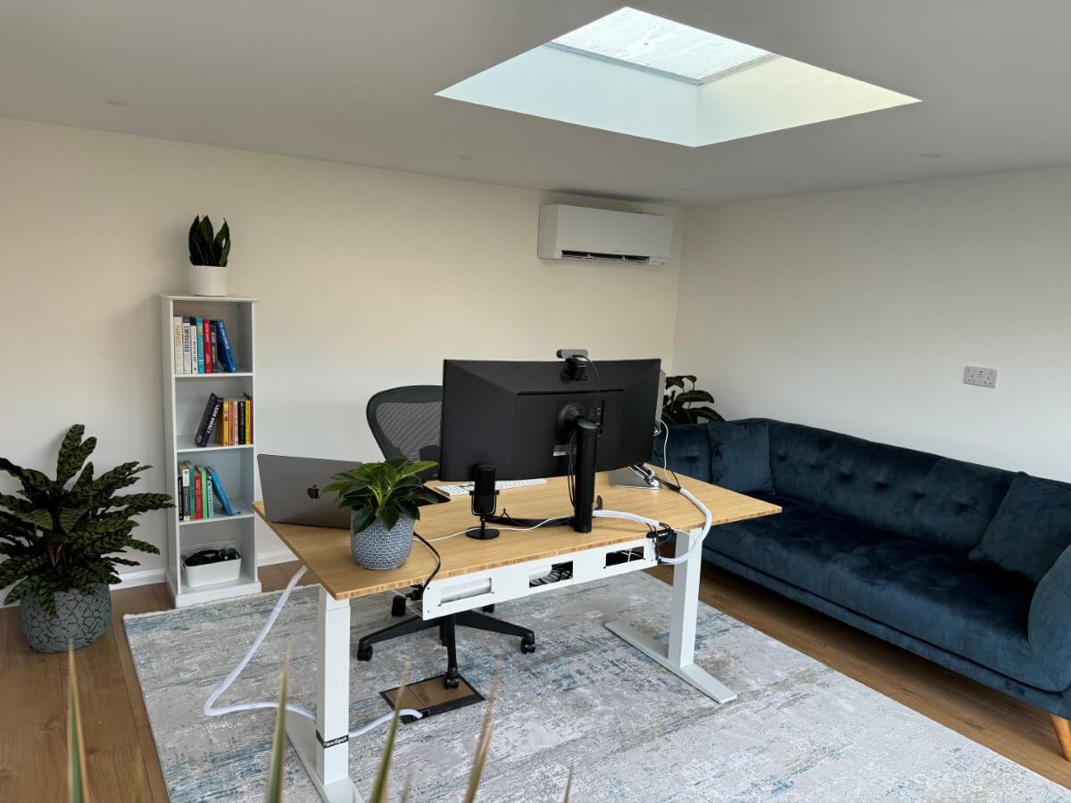 Bespoke spacious garden office with attached garden storage in Woking Surrey, interior photo - Design and built by Garden Rooms by Drumbeat